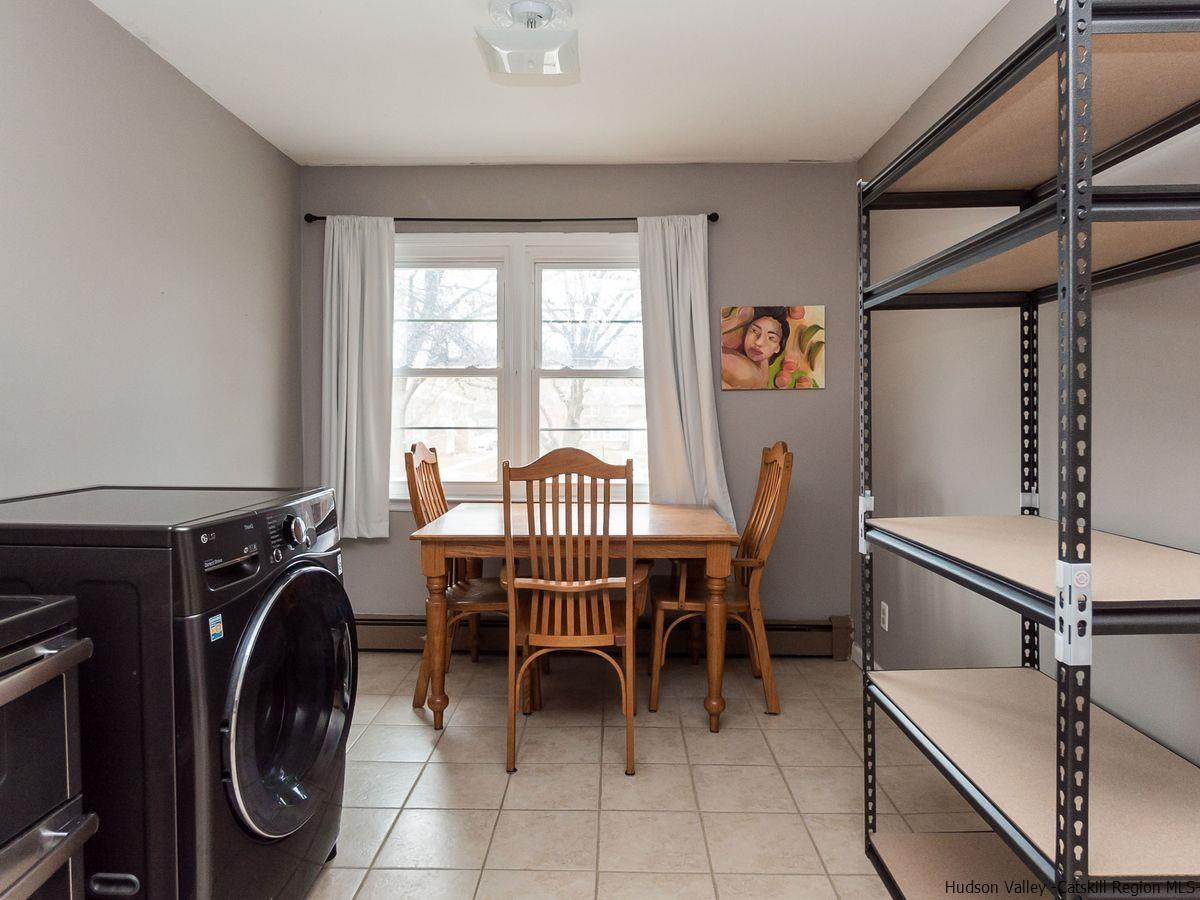 2710 South Road, Unit E4 Poughkeepsie, NY 12601 - Photo 8 of 13 a view of a dining room with furniture window and outside view