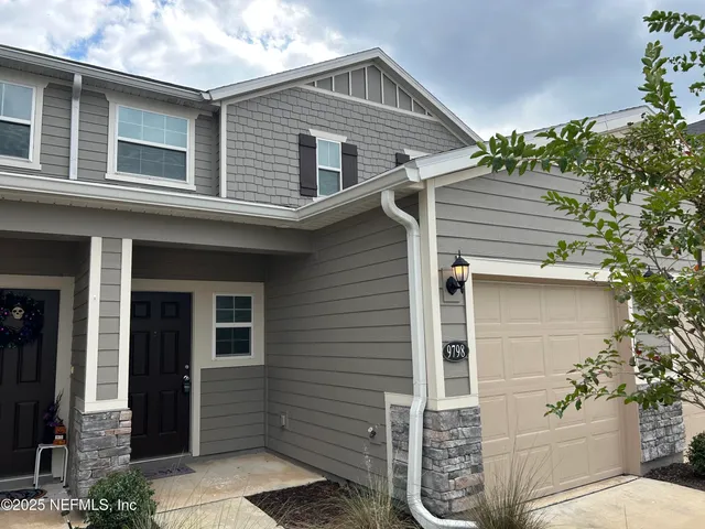 a front view of a house with a garage