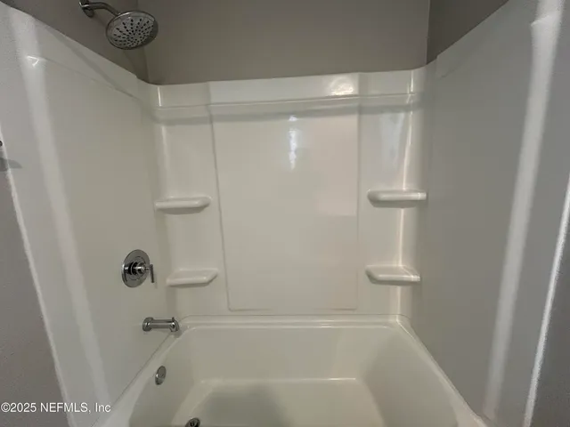 a close view of a bathtub in a bathroom