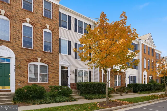 a view of a building with a yard