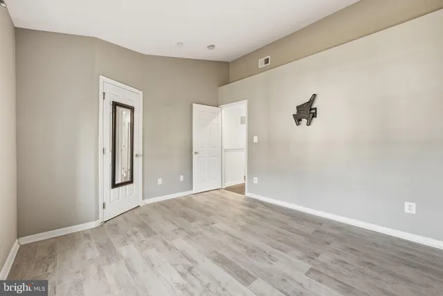 a view of a room with a wooden floor