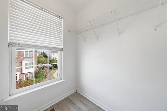 a view of a room that has a window in it