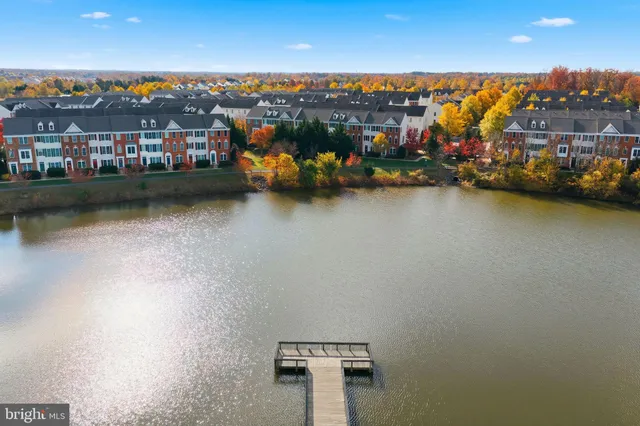 an aerial view of a residential building with outdoor space