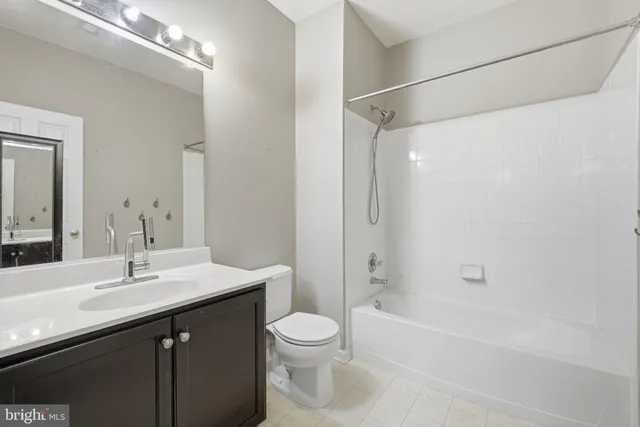 a bathroom with a sink a toilet and a bathtub