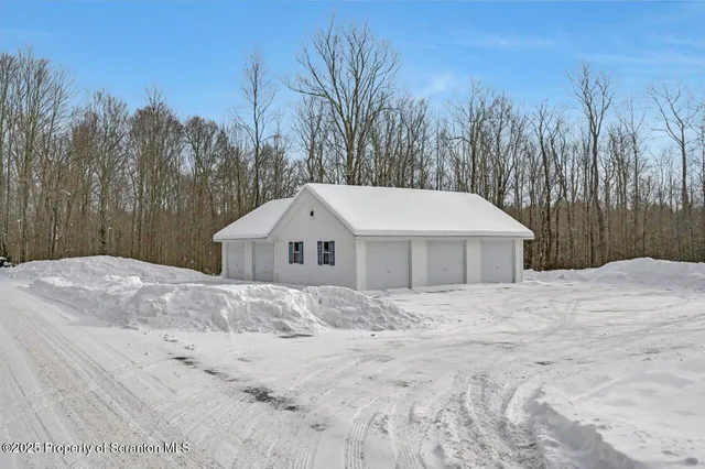 a view of garage and yard
