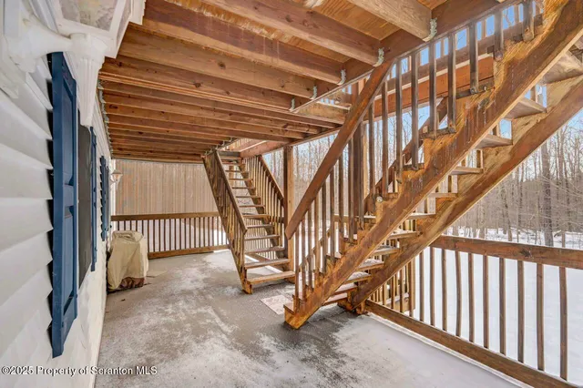 a view of an empty room with stairs