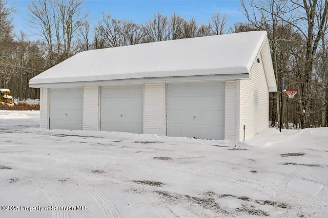 a bathroom with a mirror and a shower