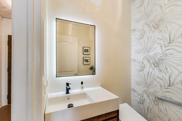 a bathroom with a sink and a mirror