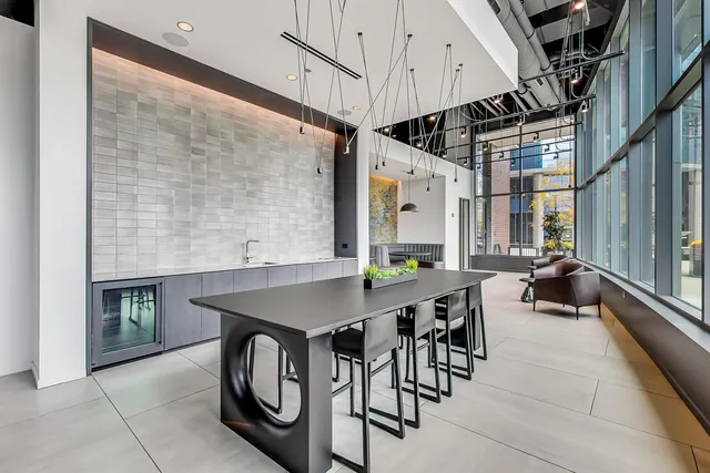 an open kitchen with a table and chairs