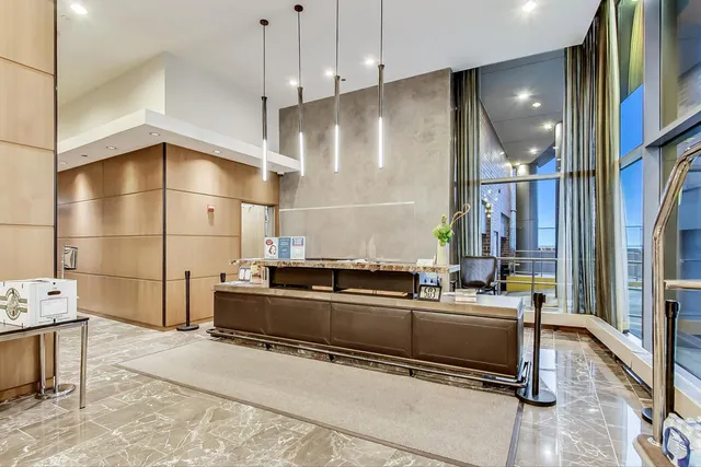 a kitchen with stainless steel appliances kitchen island granite countertop a sink and cabinets