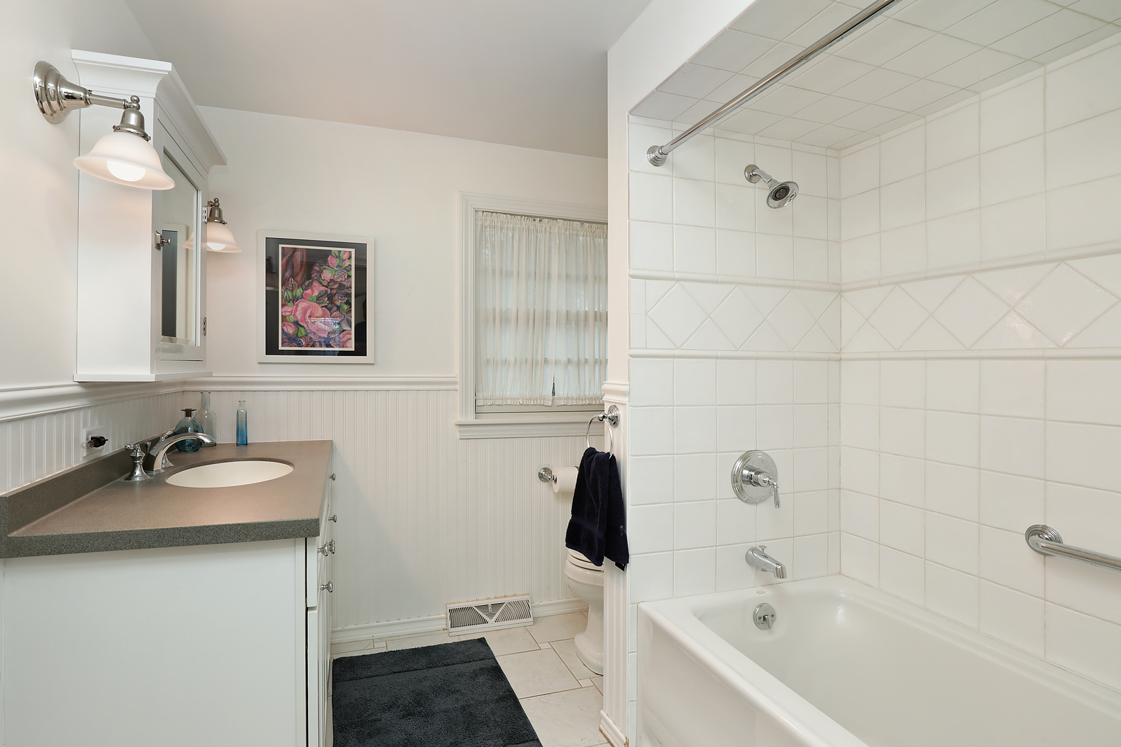 1211 Norman Lane Deerfield, IL 60015 - Photo 11 of 17 a bathroom with a sink and a bathtub