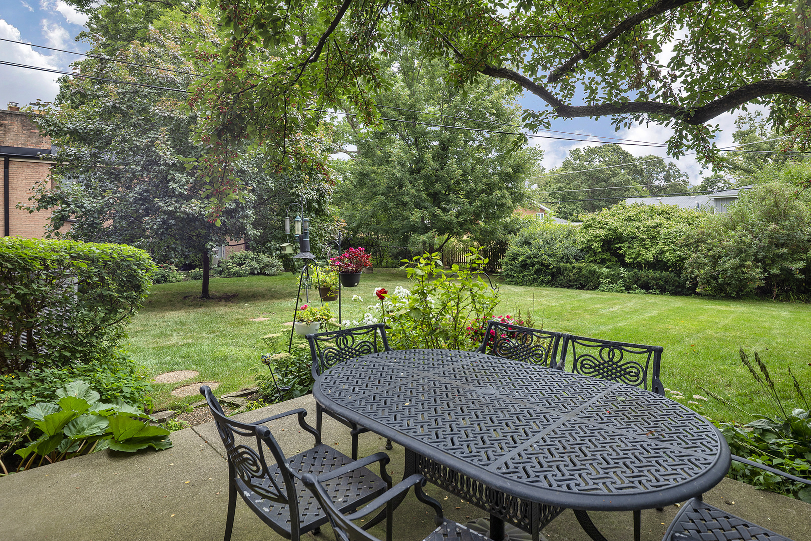 1211 Norman Lane Deerfield, IL 60015 - Photo 12 of 17 a view of a table and chairs in the garden