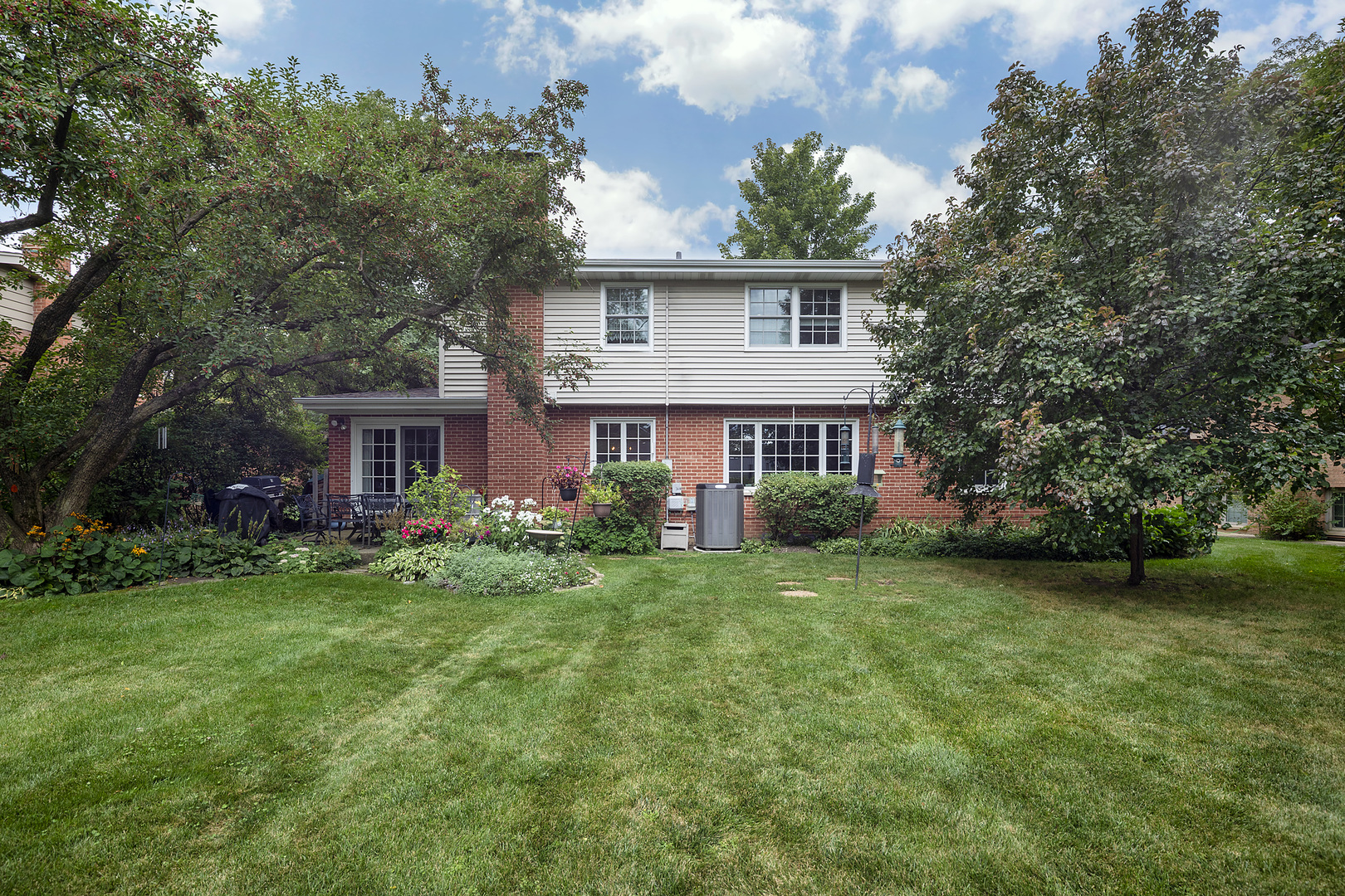 1211 Norman Lane Deerfield, IL 60015 - Photo 13 of 17 a view of a house with a big yard and large trees