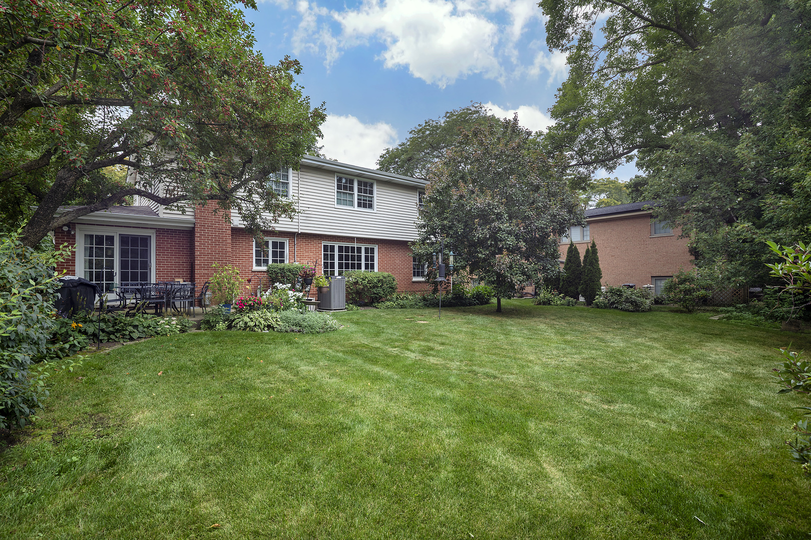 1211 Norman Lane Deerfield, IL 60015 - Photo 14 of 17 a front view of house with yard and green space