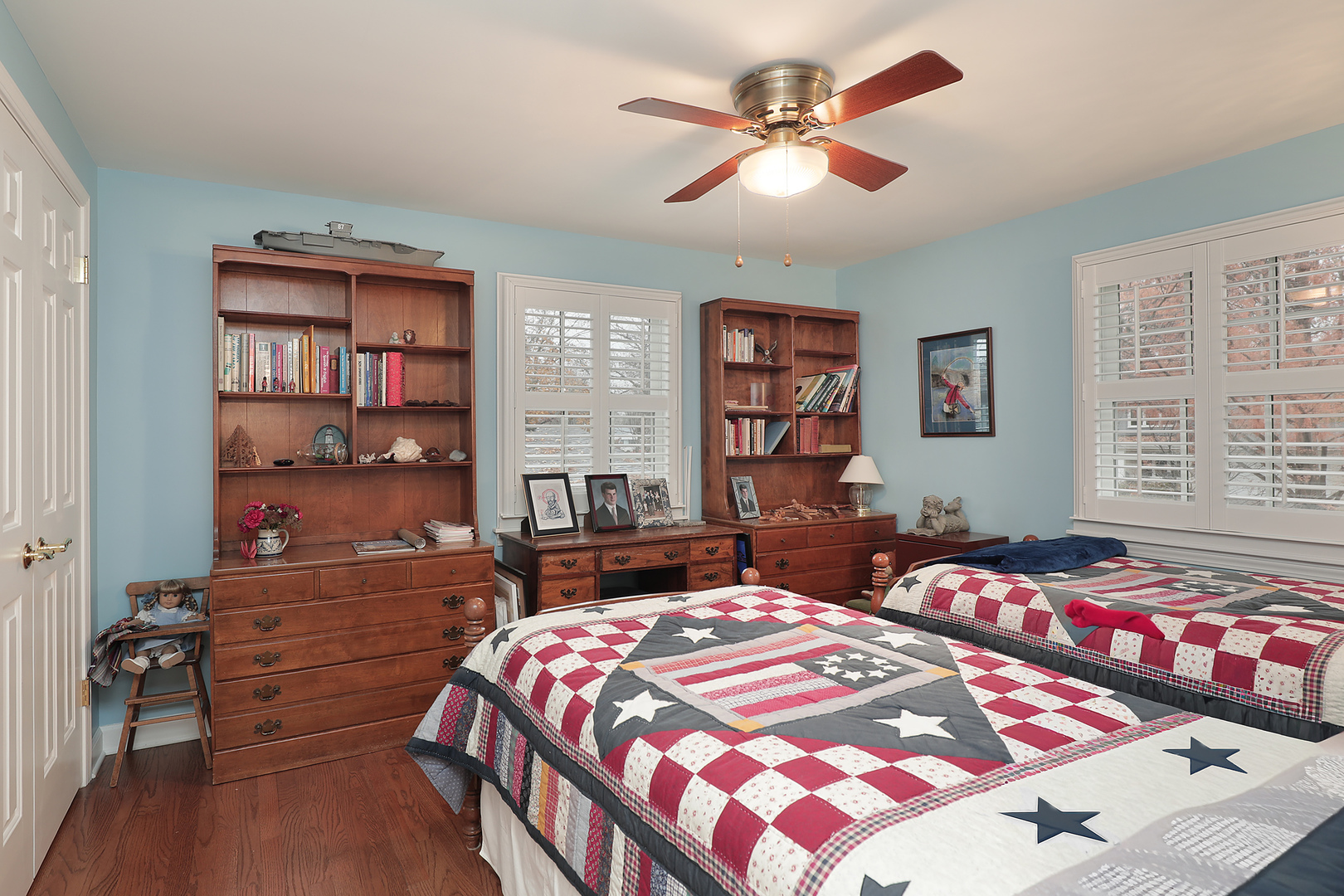 1211 Norman Lane Deerfield, IL 60015 - Photo 9 of 17 a bedroom with a bed a dresser and a chandelier