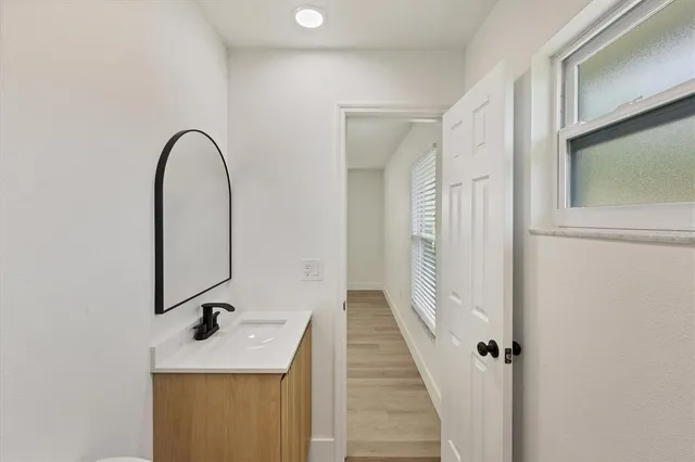 a bathroom with a sink a mirror and shower