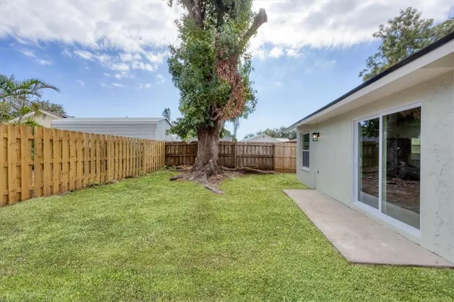 a view of a backyard with a garden