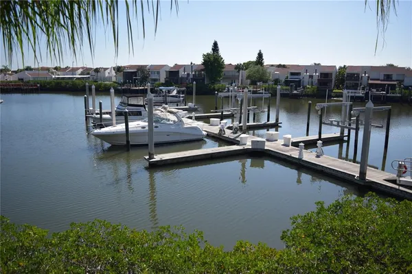 a large building with swimming pool in front of it