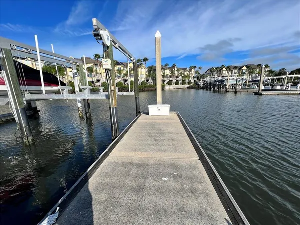 a view of a lake with a table and chairs