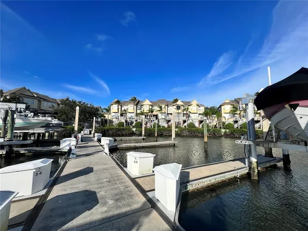 a view of a lake with a house and a yard view