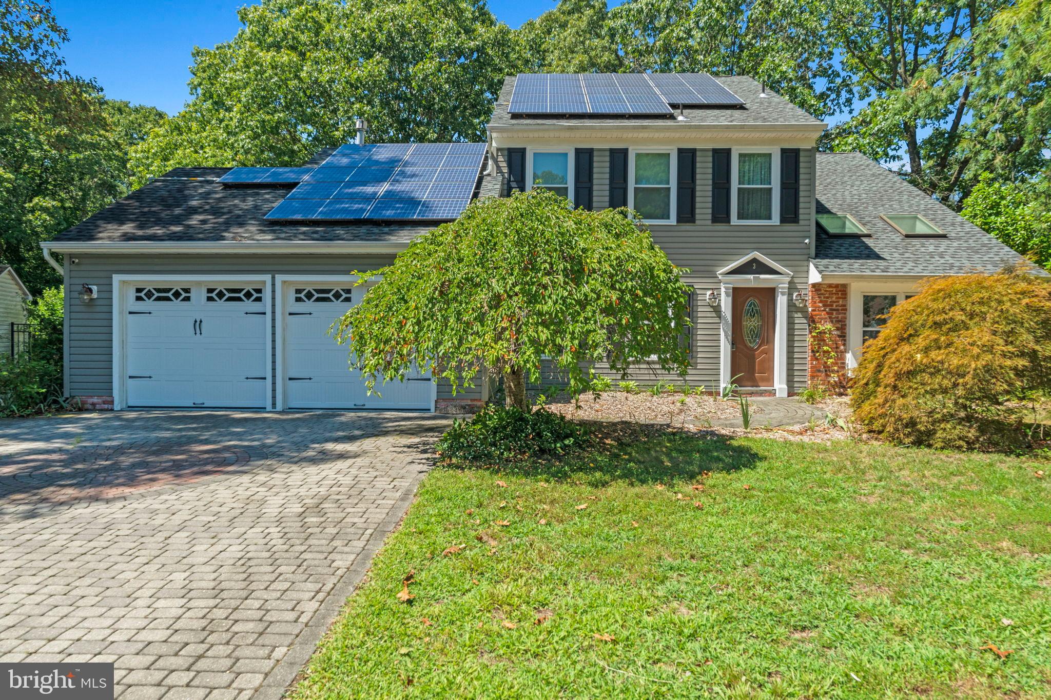 3 Spring Lake Court Sewell, NJ 08080 - Photo 1 of 36 Charming home with solar panels and lush greenery.