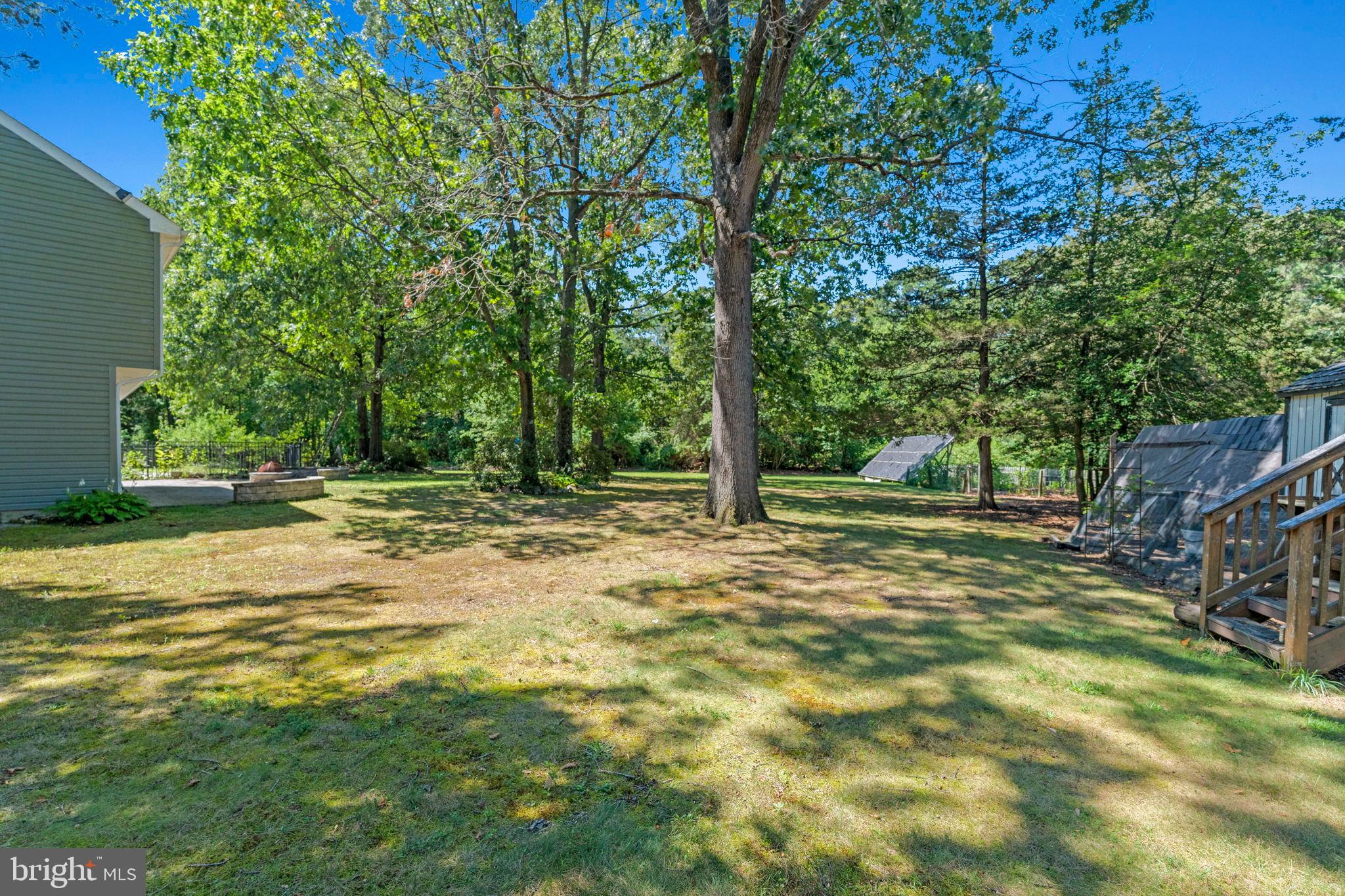 3 Spring Lake Court Sewell, NJ 08080 - Photo 29 of 36 Spacious backyard oasis with lush greenery.