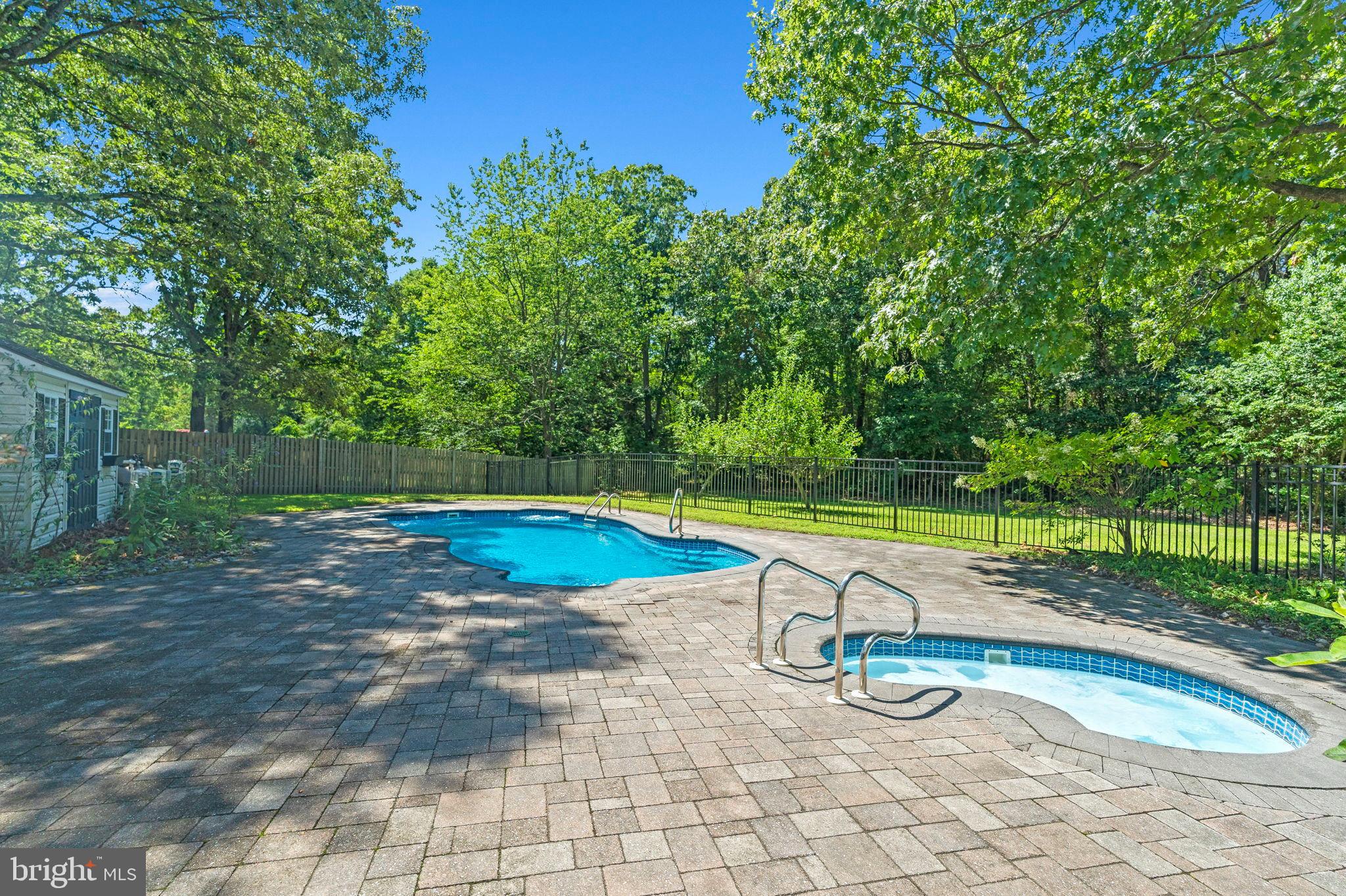 3 Spring Lake Court Sewell, NJ 08080 - Photo 32 of 36 Serene backyard oasis with inviting pools.