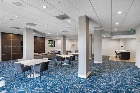 a living room with lots of furniture and a rug