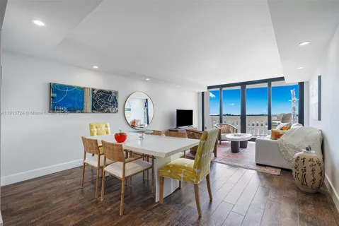 a view of a livingroom with furniture window and wooden floor