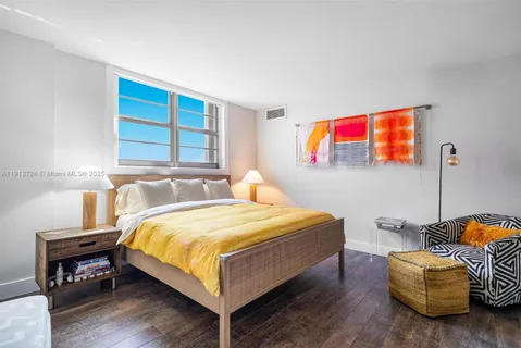 a bedroom with a bed and dresser