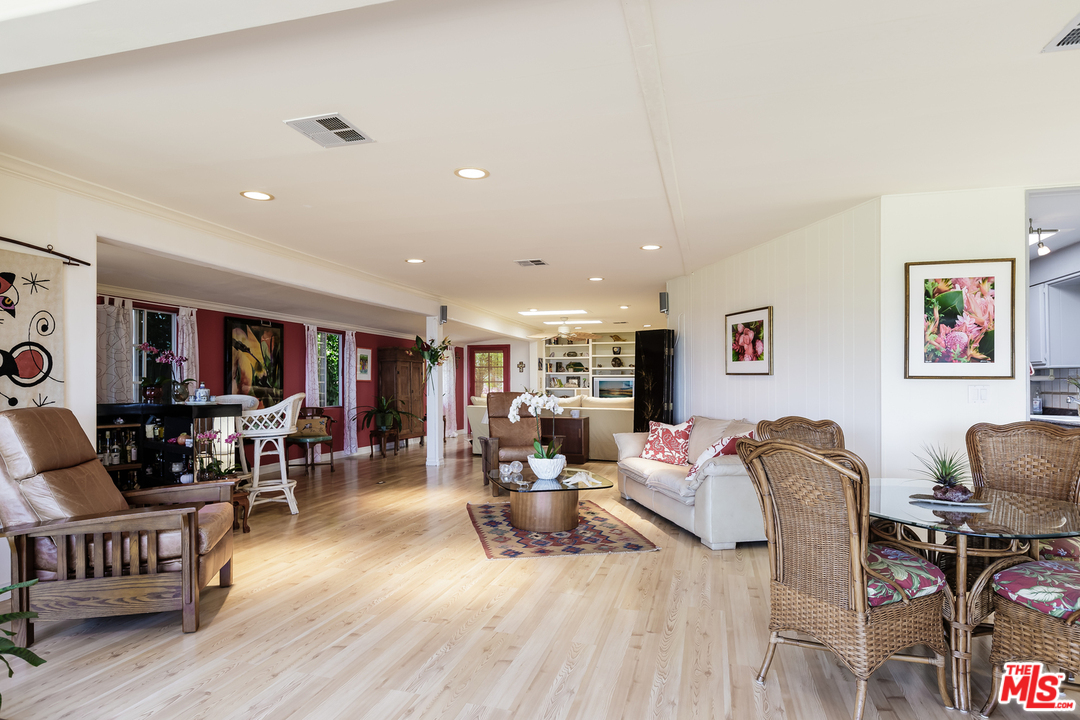 29500 Heathercliff Road, Unit 202 Malibu, CA 90265 - Photo 17 of 30 a living room with furniture and wooden floor