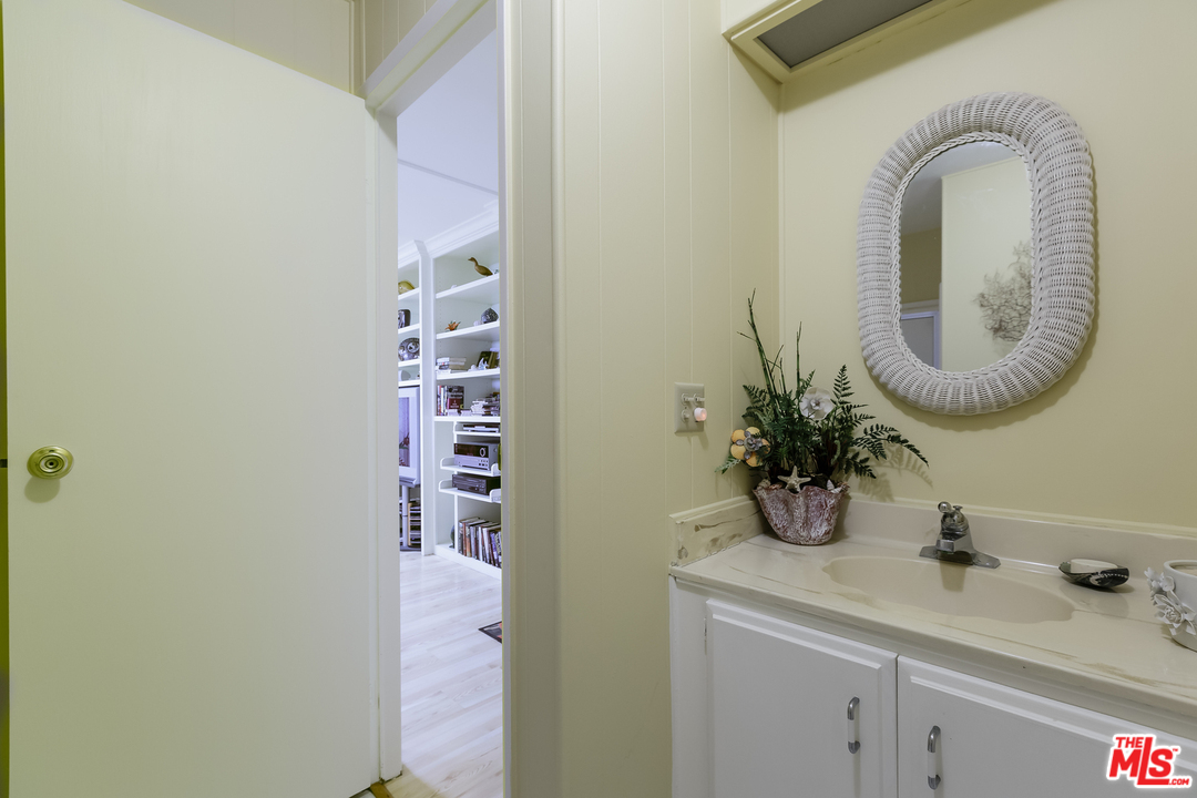 29500 Heathercliff Road, Unit 202 Malibu, CA 90265 - Photo 22 of 30 a bathroom with a sink and a mirror