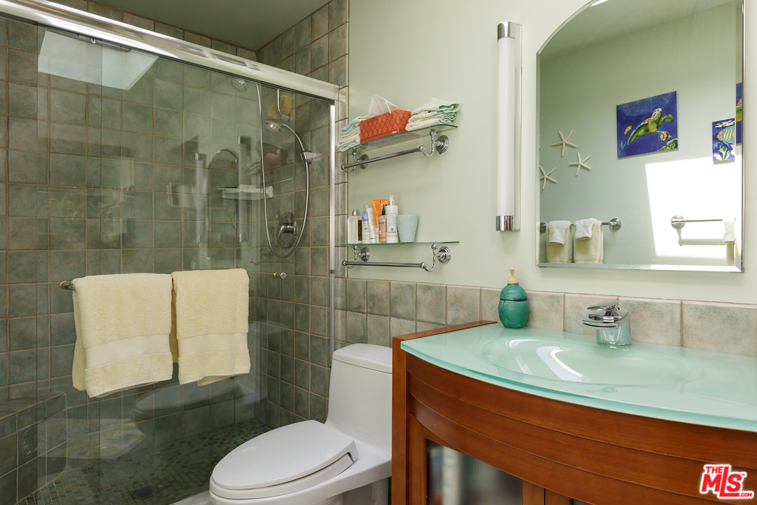 29500 Heathercliff Road, Unit 202 Malibu, CA 90265 - Photo 25 of 30 a bathroom with a sink toilet and shower