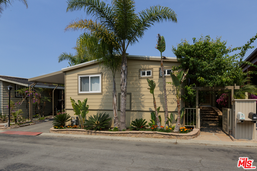 29500 Heathercliff Road, Unit 202 Malibu, CA 90265 - Photo 29 of 30 a front view of a house with garden