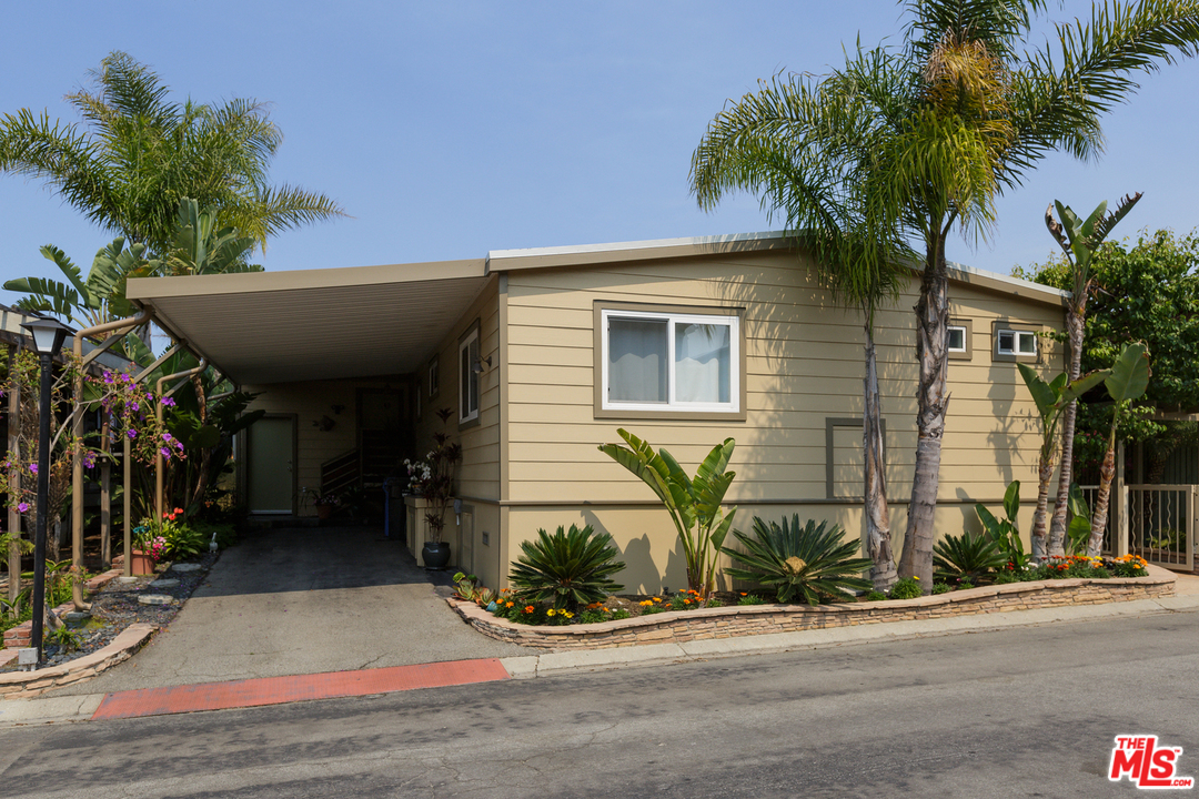 29500 Heathercliff Road, Unit 202 Malibu, CA 90265 - Photo 30 of 30 a front view of a house with garage