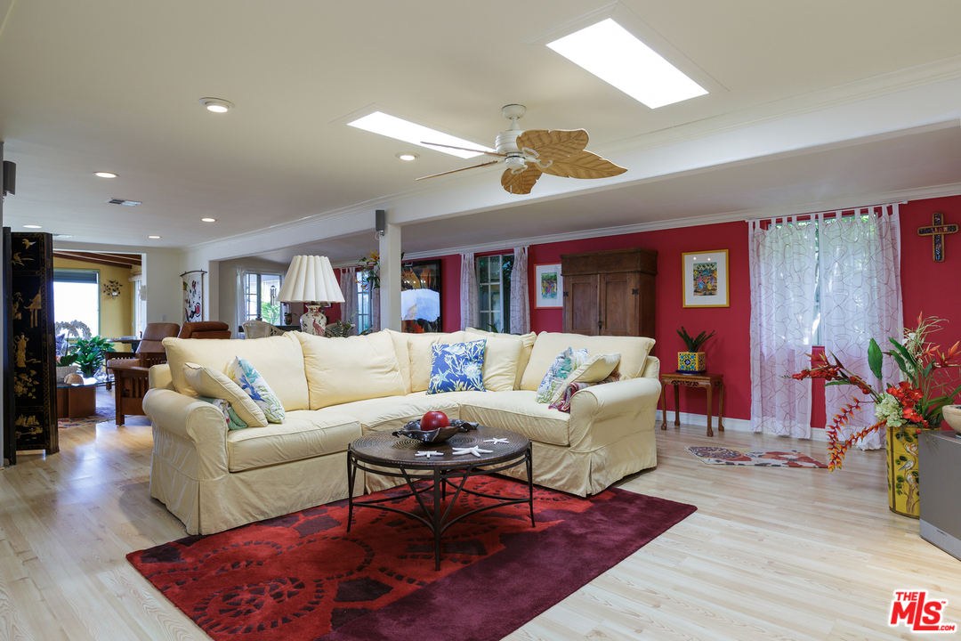 29500 Heathercliff Road, Unit 202 Malibu, CA 90265 - Photo 10 of 30 a living room with furniture kitchen view and a wooden floor