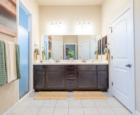 a bathroom with a sink vanity and mirror