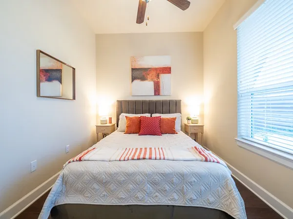a bedroom with a bed and window