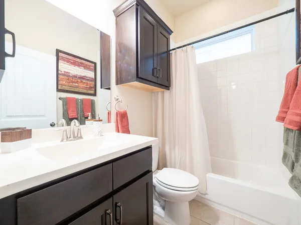 a bathroom with a sink a toilet and a bathtub
