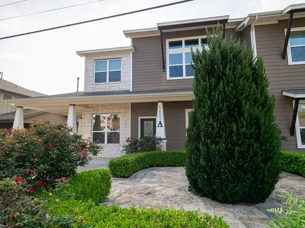 a house view with a garden space