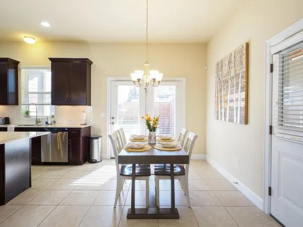 a view of a dining room with furniture and window