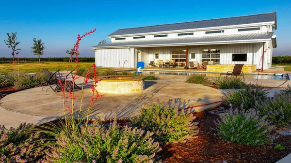 a view of a swimming pool with an outdoor seating