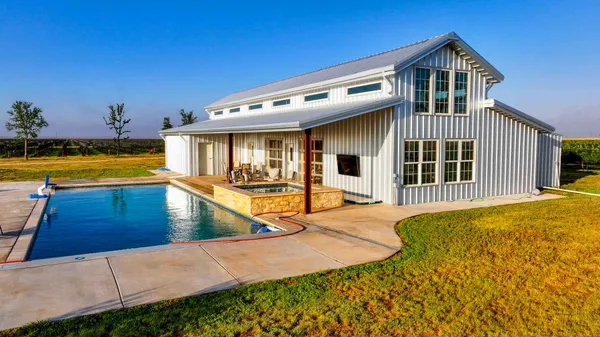 a view of a house with swimming pool