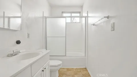 a bathroom with a toilet and shower