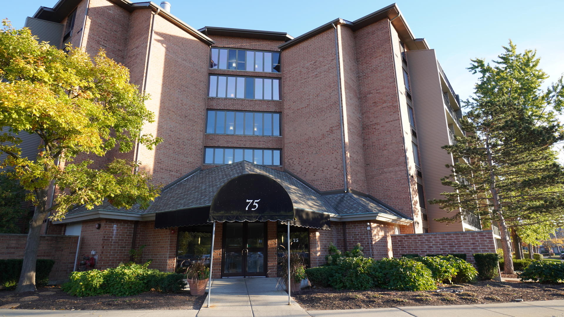 a front view of a building with street view