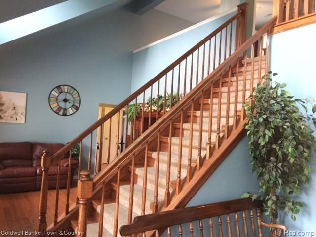 4770 Golf Club Road Howell, MI 48843 - Photo 31 of 59 Staircase leading to upper level loft and bedroom