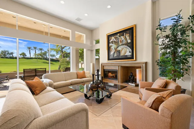 a kitchen with stainless steel appliances kitchen island granite countertop a table and chairs
