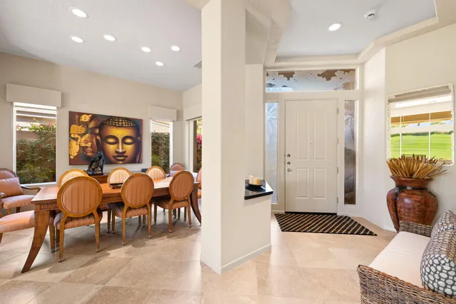 a bedroom with a bed cabinets and window
