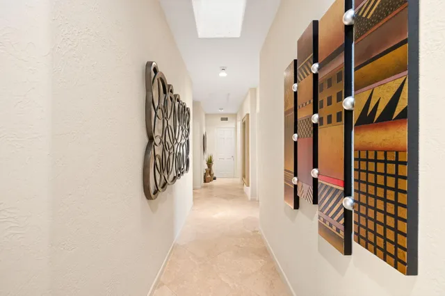 a bathroom with a granite countertop sink a mirror and a shower