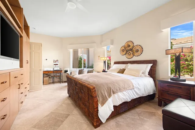 a bathroom with a granite countertop sink a mirror and a shower